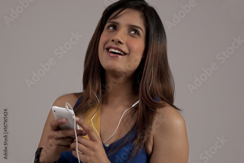 Woman listening to music on her phone 