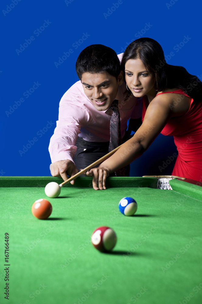 Fototapeta premium Man teaching woman pool