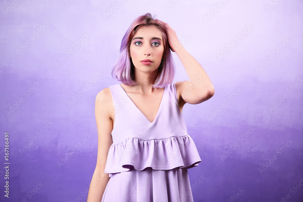Beautiful young woman in dress on lilac background Beautiful young woman in dress on lilac background