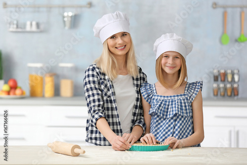 Mother and daughter cooking...