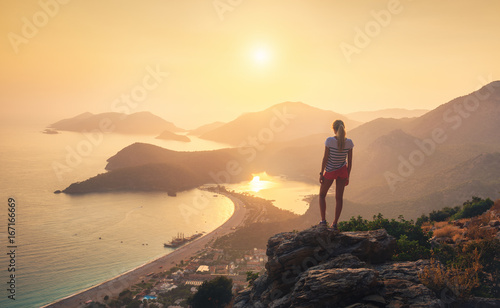 Young woman standing on the...