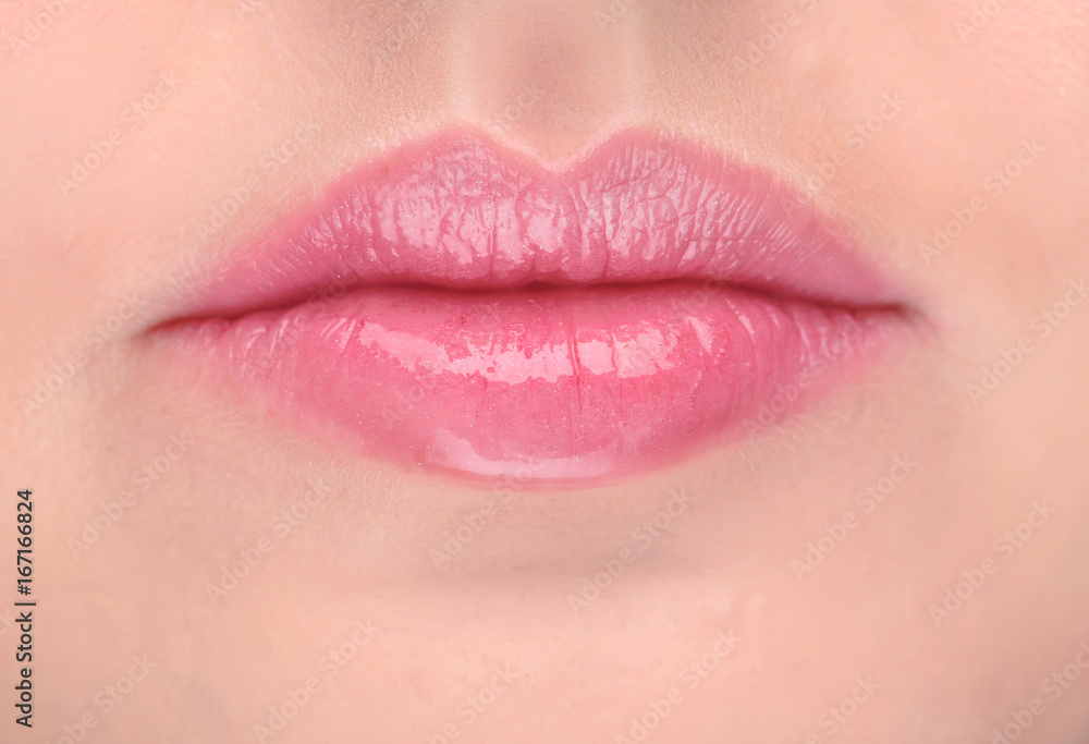 Fototapeta premium Lips of beautiful young woman, closeup