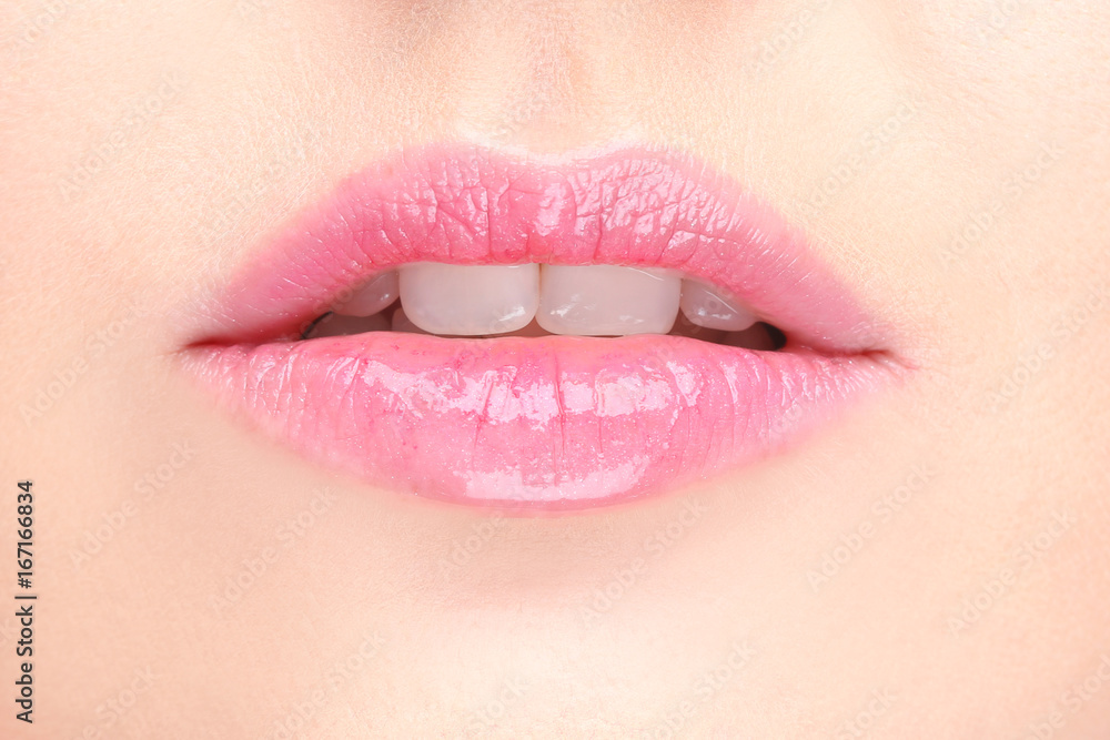 Fototapeta premium Lips of beautiful young woman, closeup