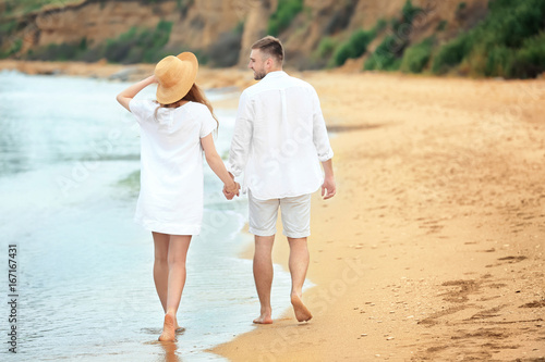 Happy young couple walking ...
