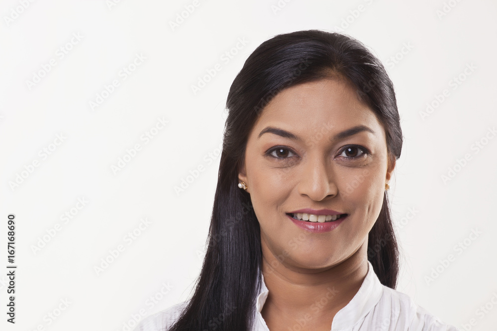 Mid adult woman smiling over white background Mid adult woman smiling over white background