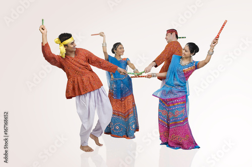Gujarati couples performing dandiya 