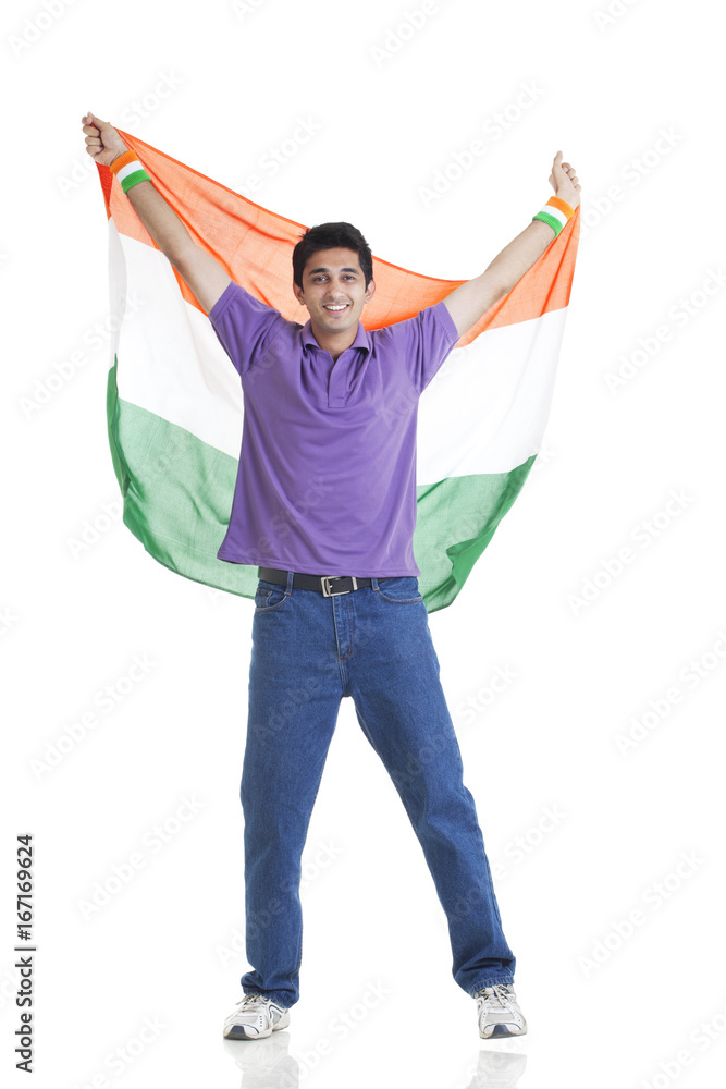 Full length portrait of young man in casuals holding Indian flag over white  background Stock Photo | Adobe Stock