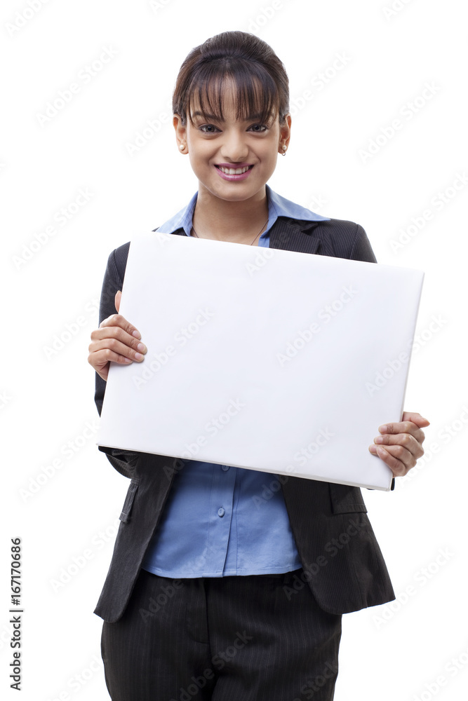 Portrait of smiling businesswoman holding blank card over white background Portrait of smiling businesswoman holding blank card over white background