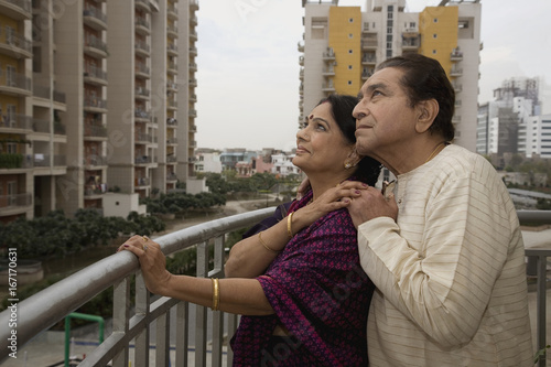 Old couple standing on a balcony  © IndiaPix