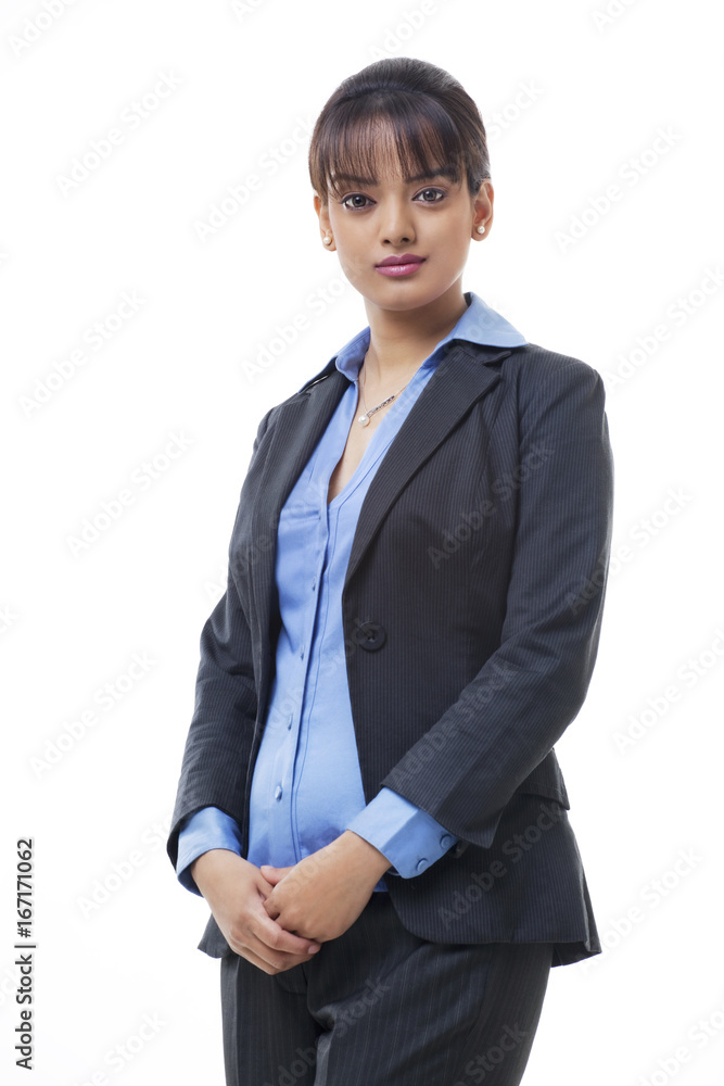 Portrait of confident young businesswoman standing on white background Portrait of confident young businesswoman standing on white background