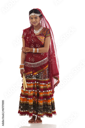 Portrait of a female dandiya dancer with sticks 