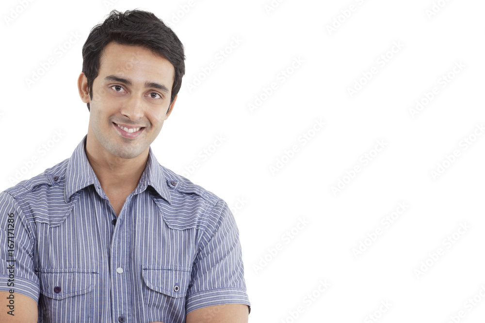 Close-up portrait of man smiling over white background Close-up portrait of man smiling over white background