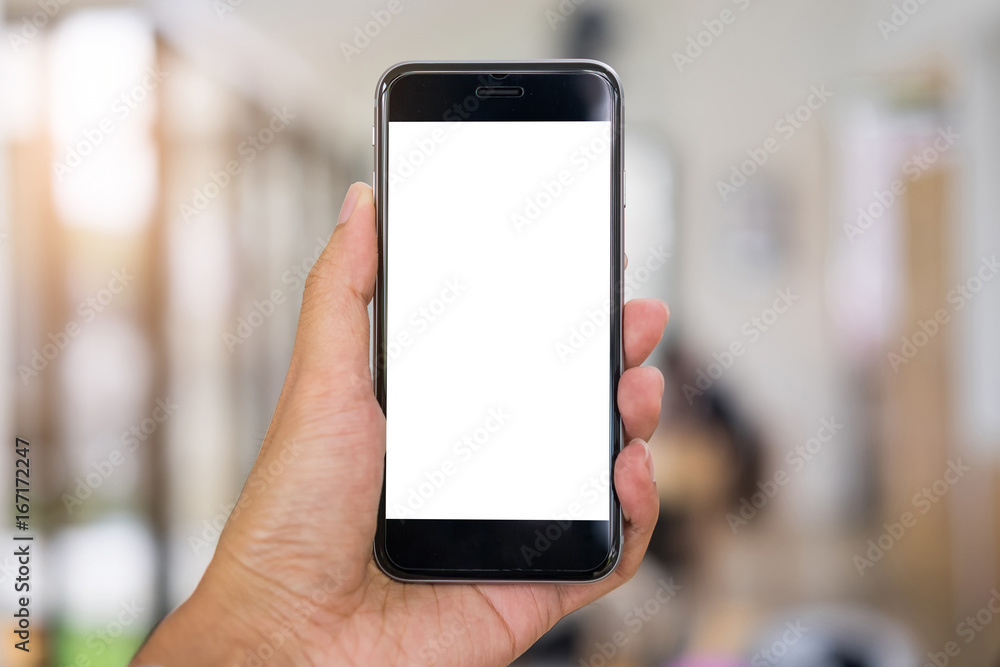 Close up of a man hand hold smartphone with blank screen mobile in coffee shop. Close up of a man hand hold smartphone with blank screen mobile in coffee shop.