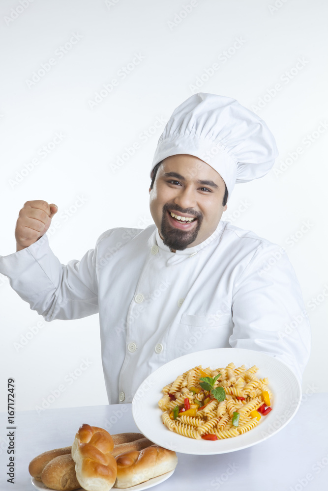 Portrait of chef with plate of pasta Portrait of chef with plate of pasta