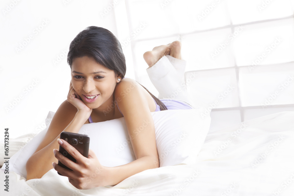 Girl looking at picture on mobile phone Girl looking at picture on mobile phone