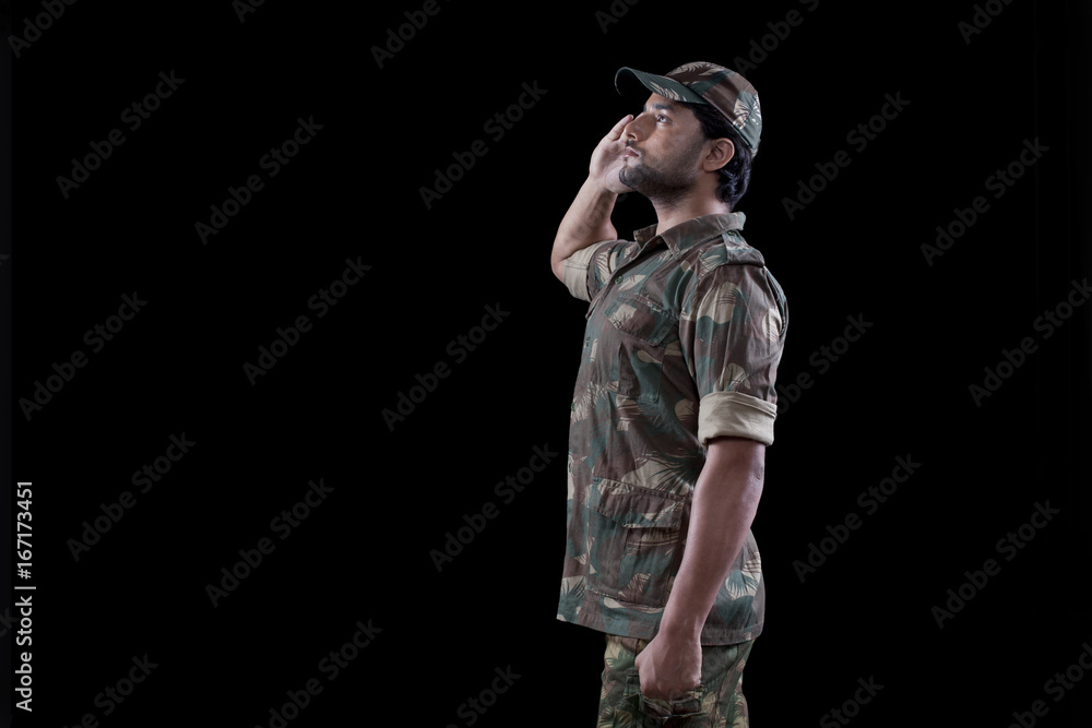 Male military soldier saluting over black background Male military soldier saluting over black background