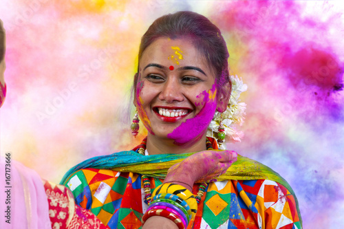 Canvas Print Portrait of  young Indian Woman celebrating Holi color festival