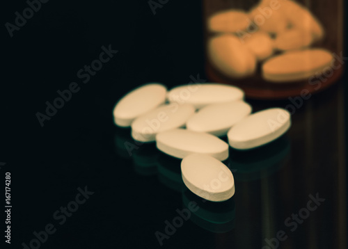 Pills out of pill bottle, prescription, drugs, bottle