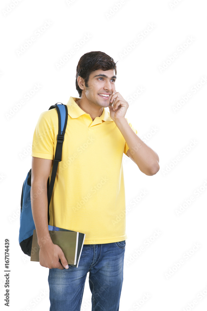 College student talking on a mobile phone College student talking on a mobile phone