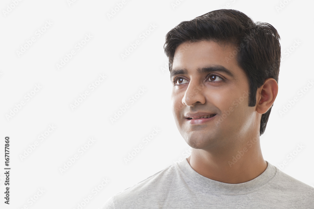 Smart young man smiling over white background Smart young man smiling over white background
