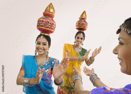 Gujarati women dancing with a kalash on their head 