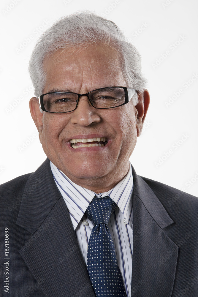 Portrait of an old businessman smiling Portrait of an old businessman smiling