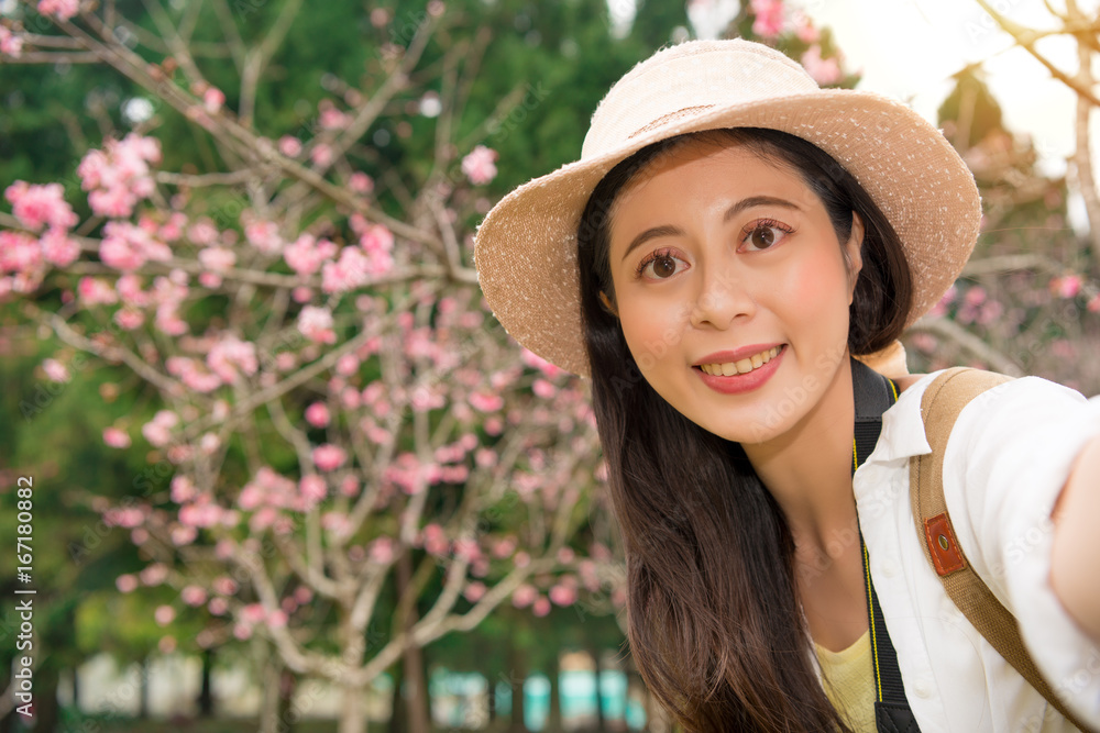 pretty young woman tourist takes selfie portrait