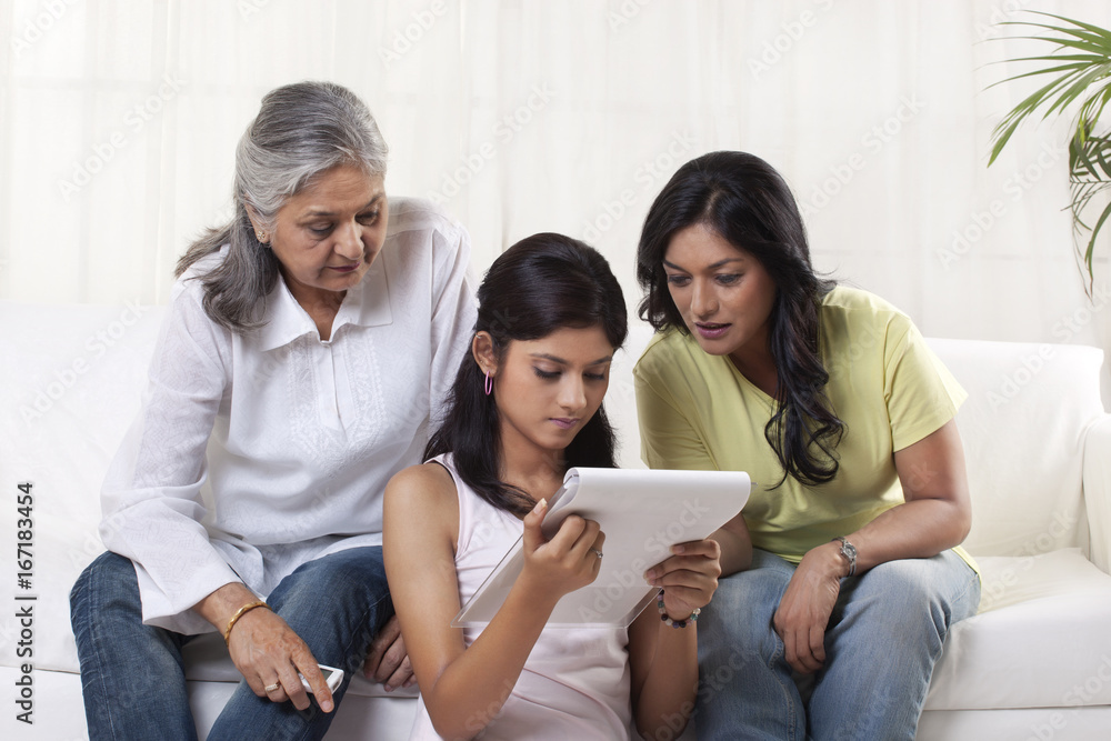 Family reading documents at home Family reading documents at home