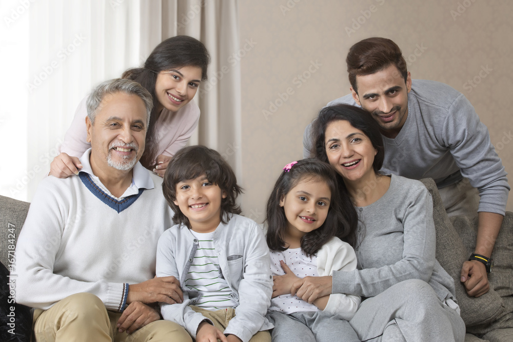 Portrait of smiling multi-generation family on sofa