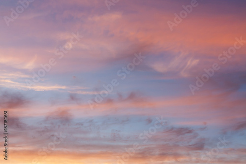 Pink, red and orange clouds in the sky © marketlan