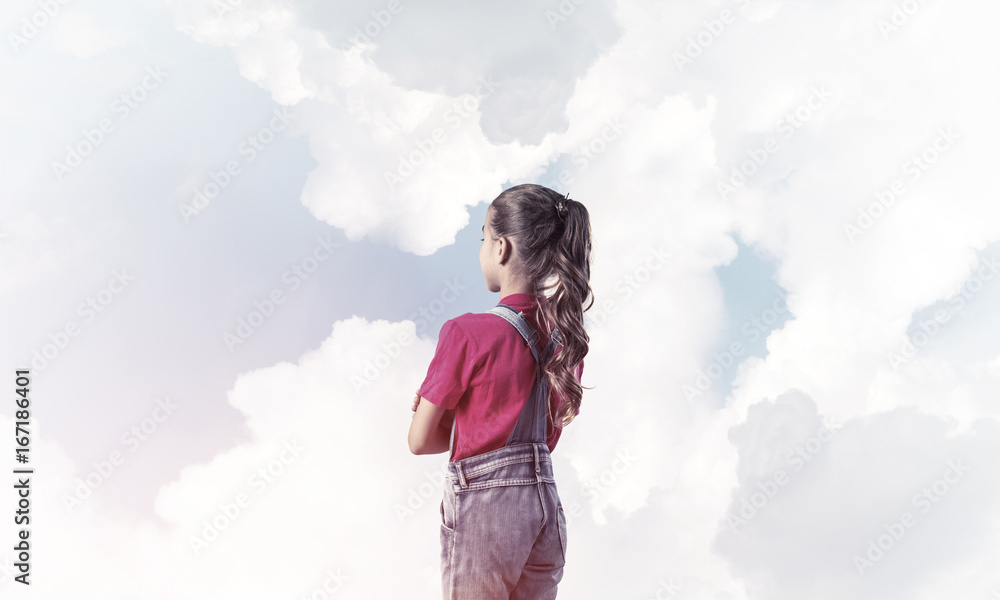 Concept of careless happy childhood with girl looking in future Concept of careless happy childhood with girl looking in future