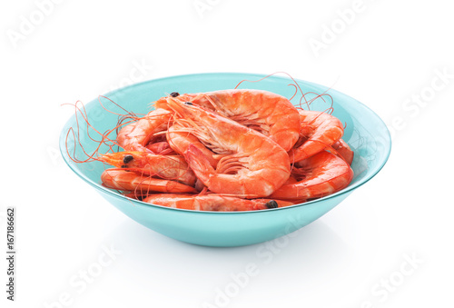 Fresh cooked shrimp on a plate isolated on white background.