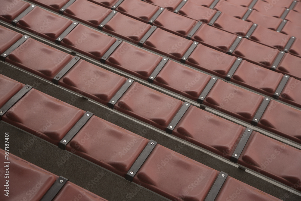 Rows of Empty Rust Colored Amphitheater Stadium Seats, Looking Down Angular Point of View