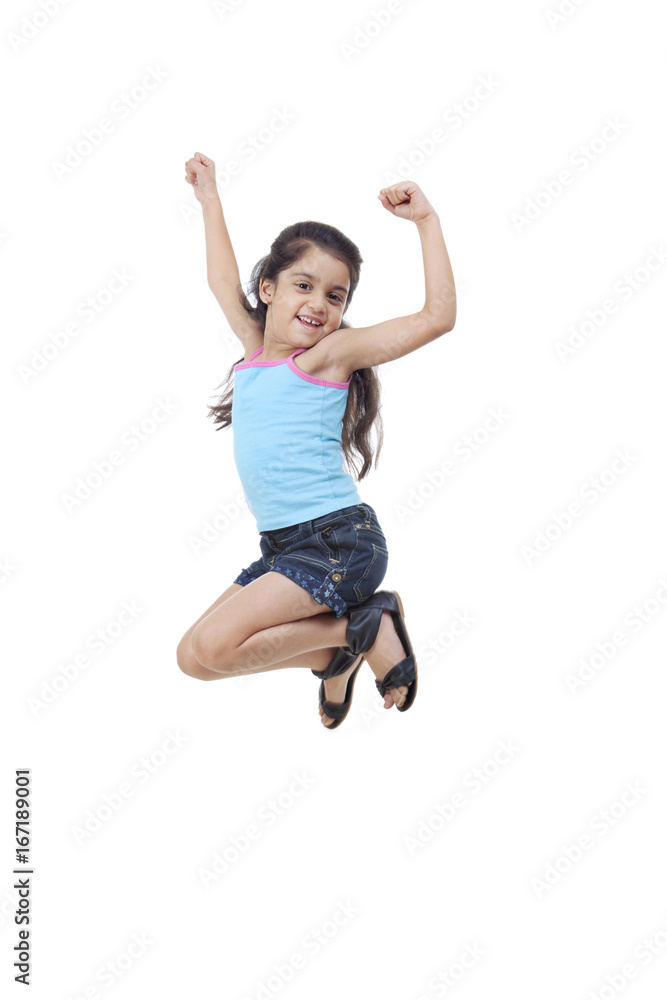 Little girl jumping in the air 