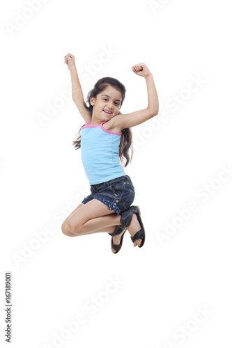 Little girl jumping in the air 