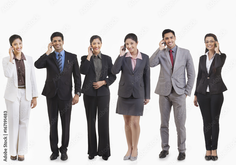 Business executives talking on a mobile phone Business executives talking on a mobile phone
