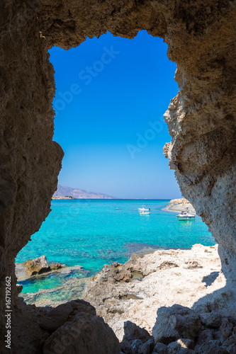 Amazing view of Koufonisi island with magical turquoise waters  lagoons  tropical beaches of pure white sand and ancient ruins on Crete  Greece