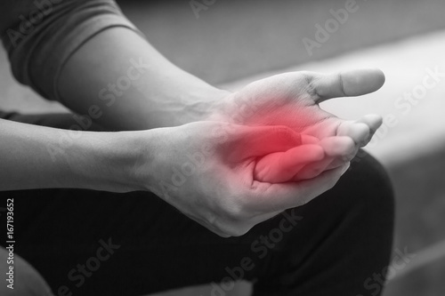 man suffering from trigger finger  arthritis  wrist pain