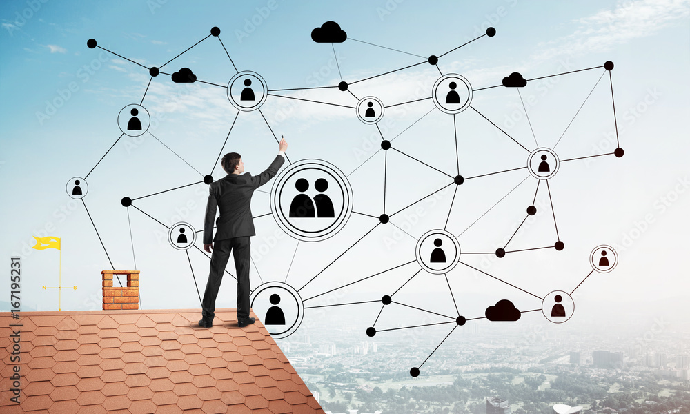 Businessman on house roof presenting networking and connection concept. Mixed media