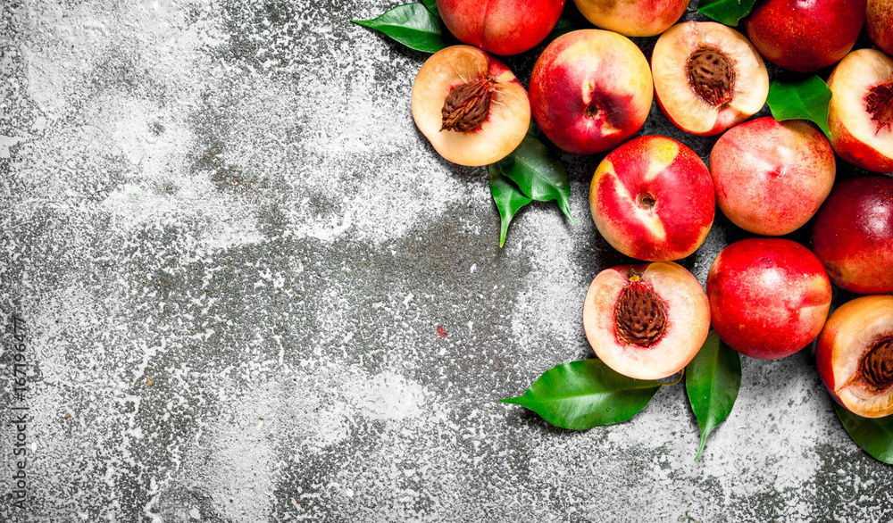 Fresh peaches with green leaves. Fresh peaches with green leaves.