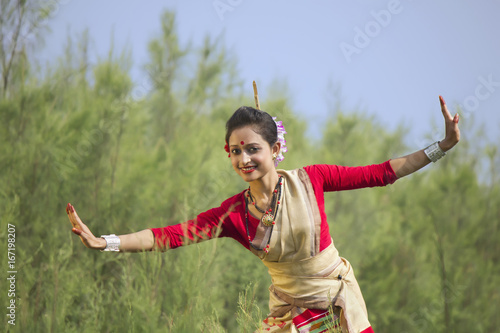 Portrait of woman doing Bihu dance 