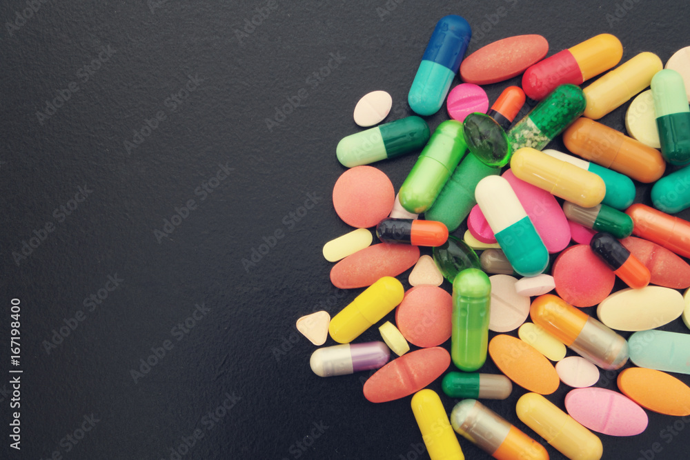 Medical concept. drugs on black table with room for text Medical concept. drugs on black table with room for text