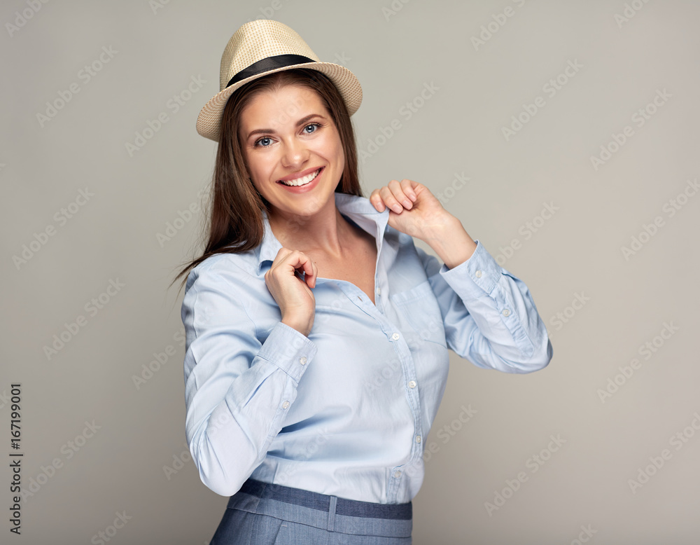 smiling woman wearing hat standing against isolated studio background. smiling woman wearing hat standing against isolated studio background.