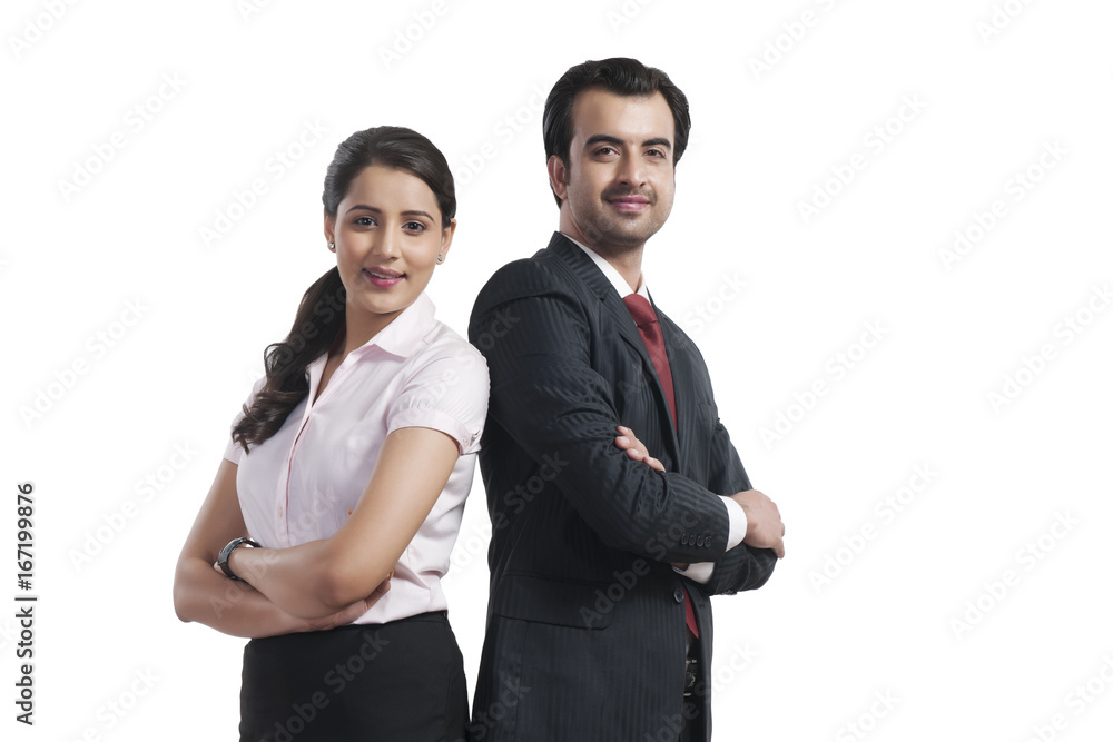 Portrait of smiling business colleagues standing arms crossed over white background Portrait of smiling business colleagues standing arms crossed over white background