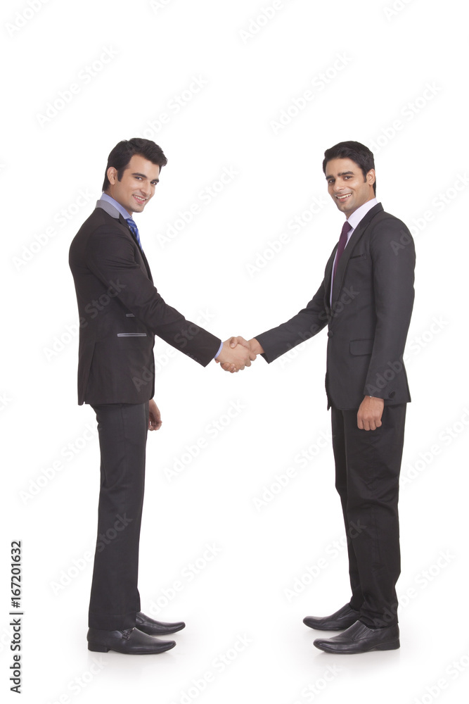 Portrait of two businessmen shaking hands Portrait of two businessmen shaking hands
