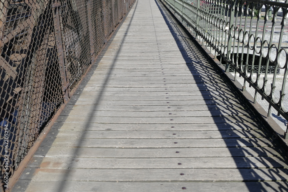 iron bridge with a pedestrian sidewalk iron bridge with a pedestrian sidewalk