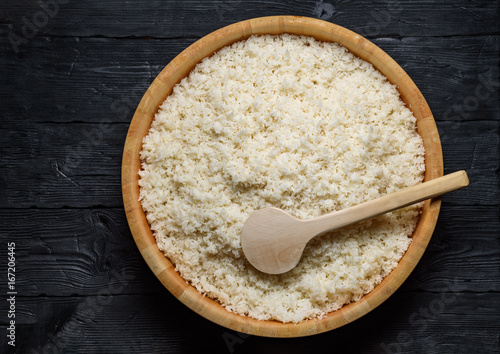 Japanese cuisine. Rice in hanghiri over dark wooden background. photo