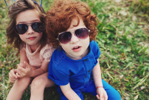 cute stylish children in summer park © Aliaksei Lasevich