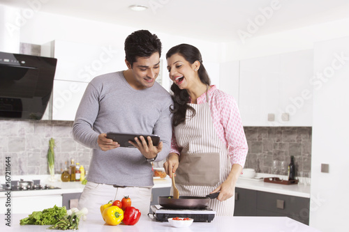 Couple looking at a digital tablet