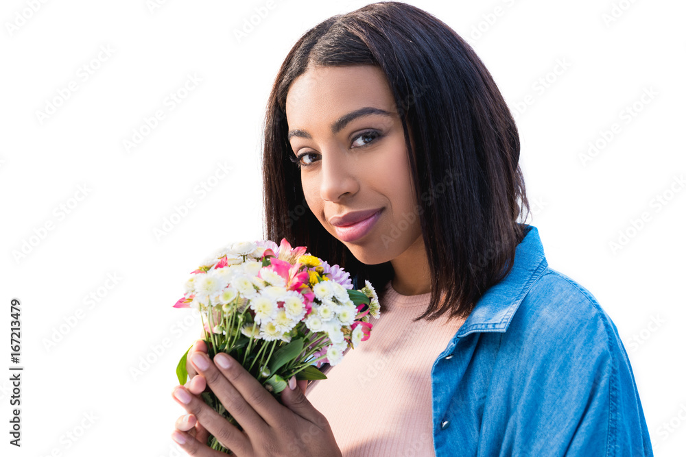 beautiful african american girl holding bouquet of flowers and smiling at camera isolated on white beautiful african american girl holding bouquet of flowers and smiling at camera isolated on white